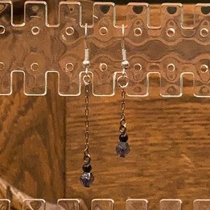 Dangly mismatched sized earrings